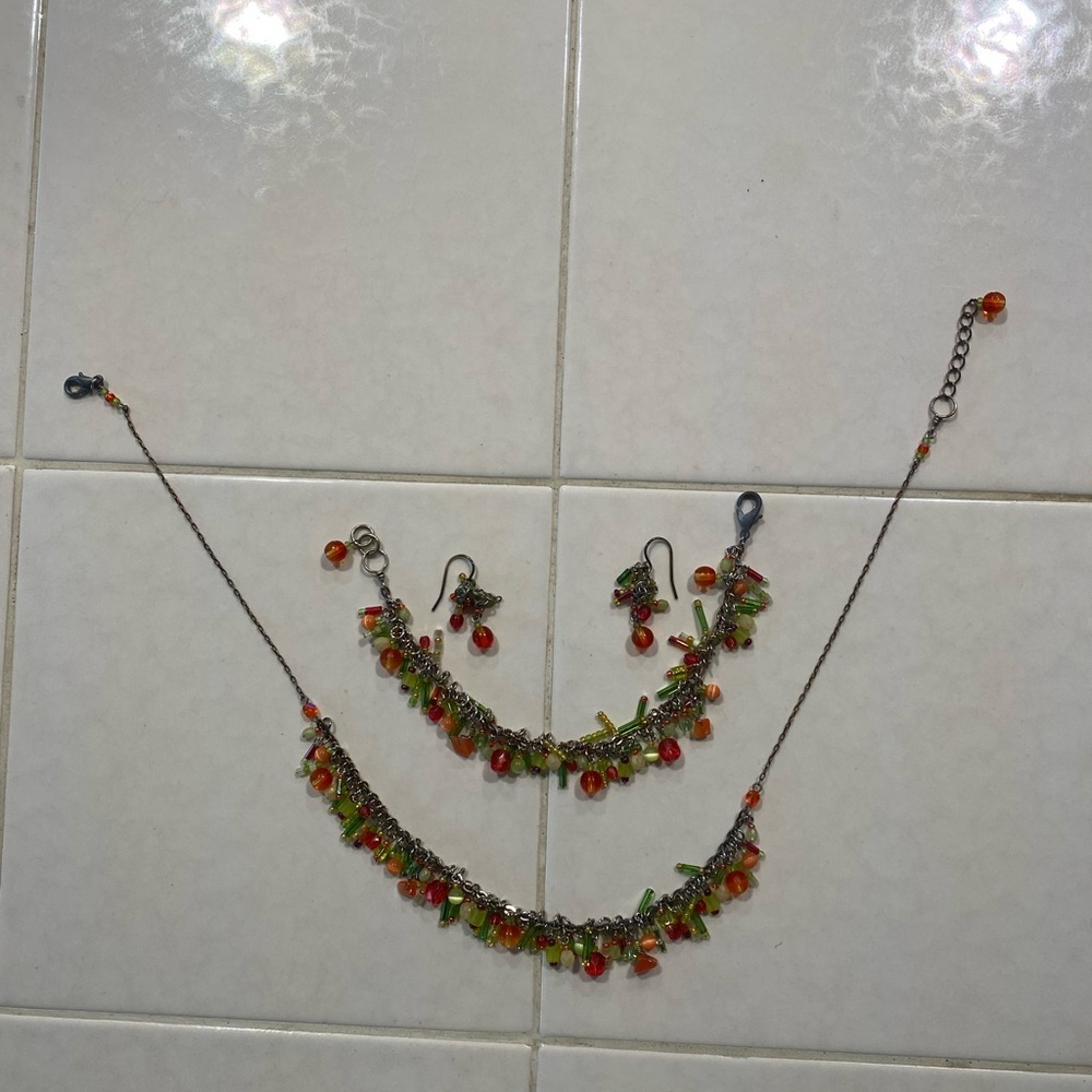 Intricate matching necklace, bracelet and earrings